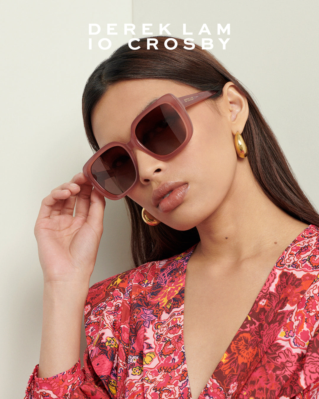 Derek Lam 10 Crosby campaign image of female model wearing blush-colored eyeglasses against plain background – women's luxury eyewear fashion photography.