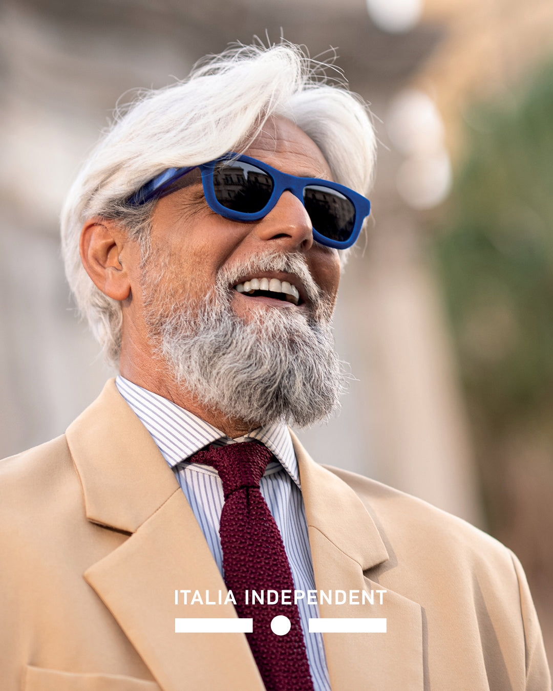 Italia Independent eyewear campaign with male model wearing sunglasses in urban city setting – luxury men’s sunglasses fashion photography.