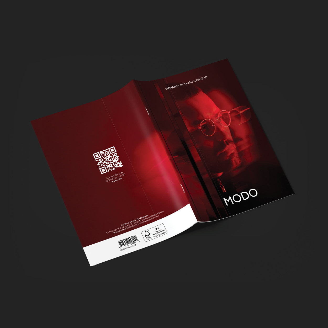 MODO Eyewear SS25 booklet mockup on dark surface – spring/summer 2025 eyewear catalog design.